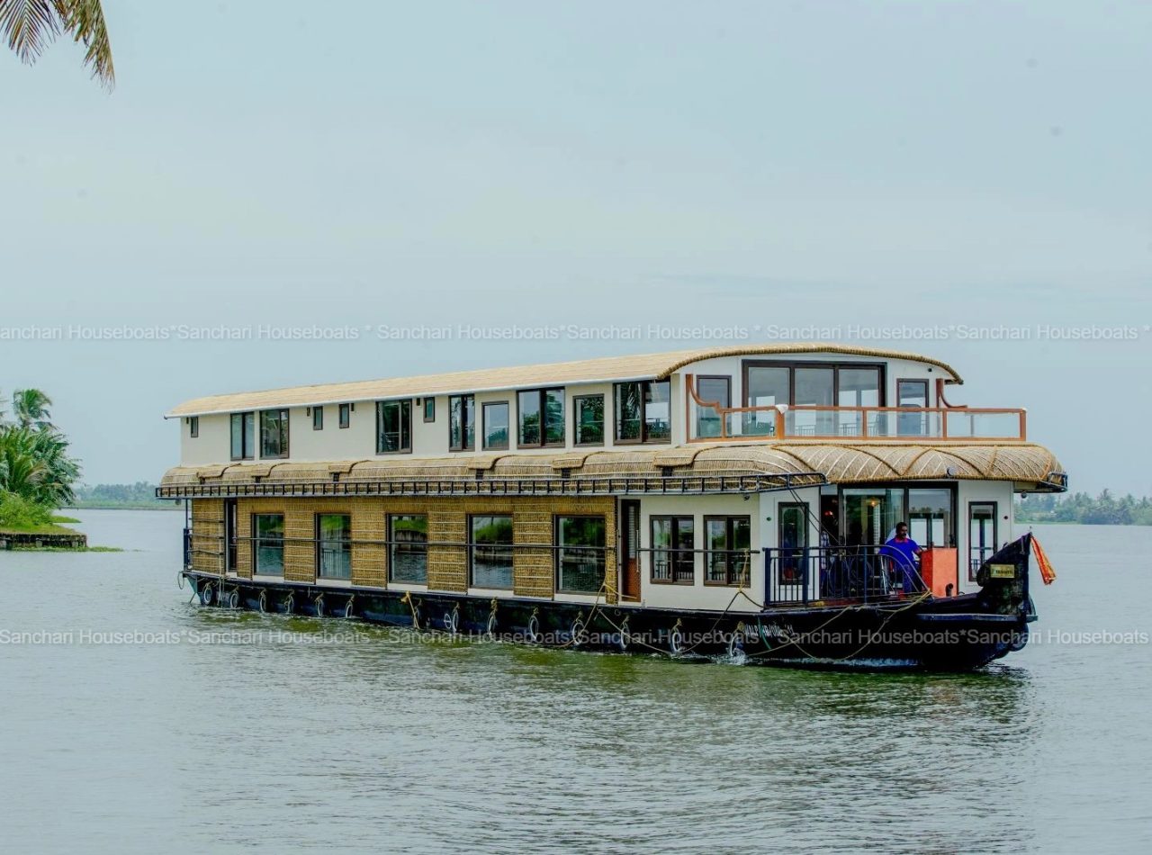 7room Double-decker new luxury houseboat cruising through the backwaters of Alleppey, Kerala.