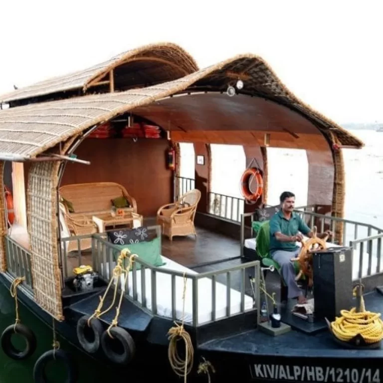 A houseboat floating peacefully on the backwaters of Alleppey, Kerala.