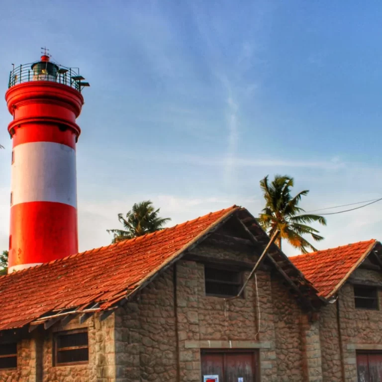 Alleppey Lighthouse standing tall against blue sky.