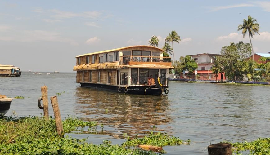 Eight-bedroom Alleppey houseboat cruising on Vembanad Lake at sunset